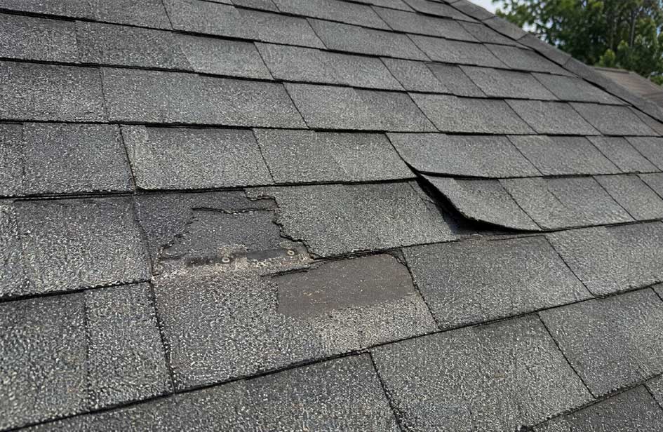 Localized lifted and damaged asphalt shingles that may be suitable for targeted roof repair